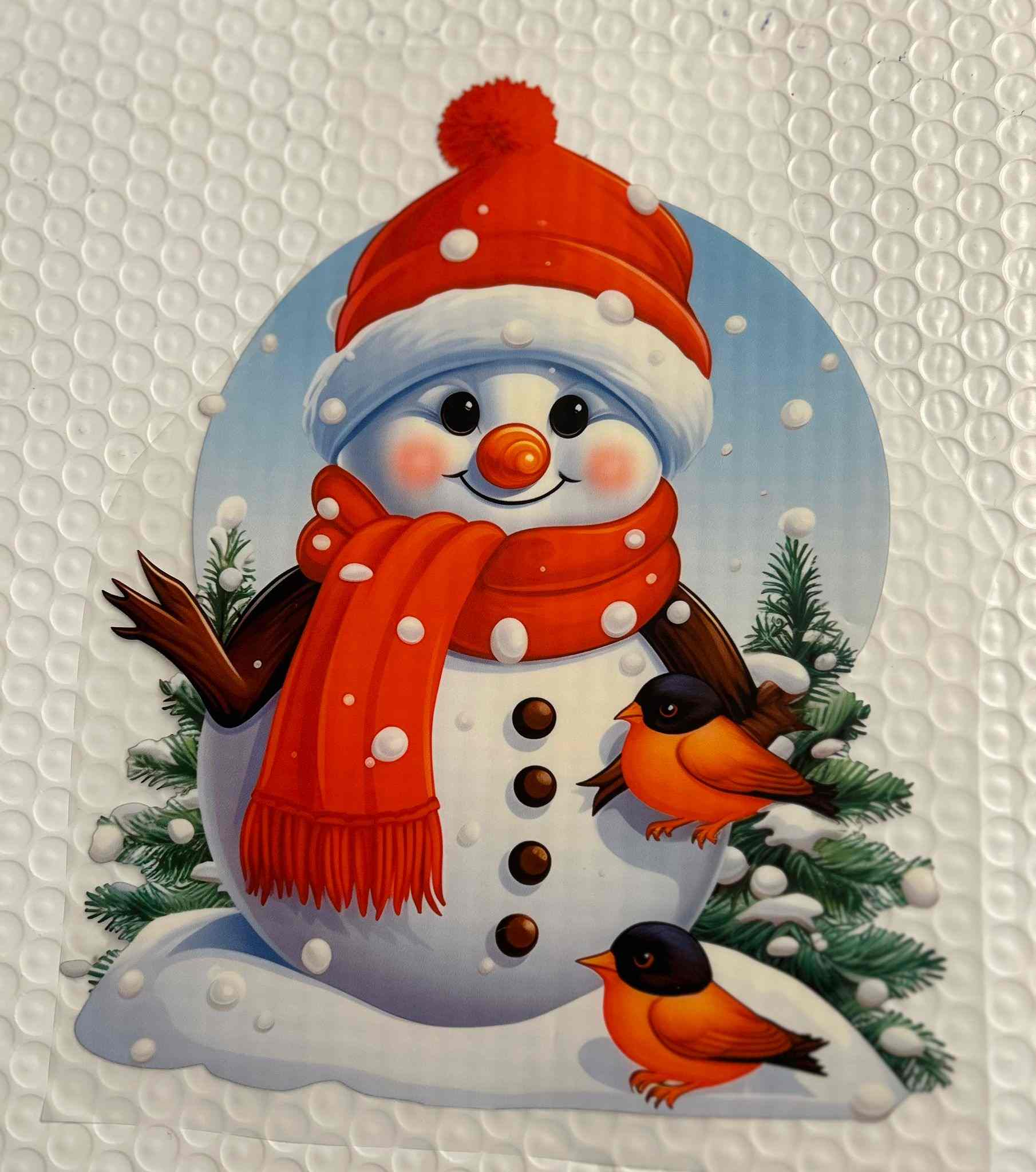 Holiday &amp; season design featuring a cheerful snowman with a red hat and scarf, accompanied by birds and snow-covered trees.