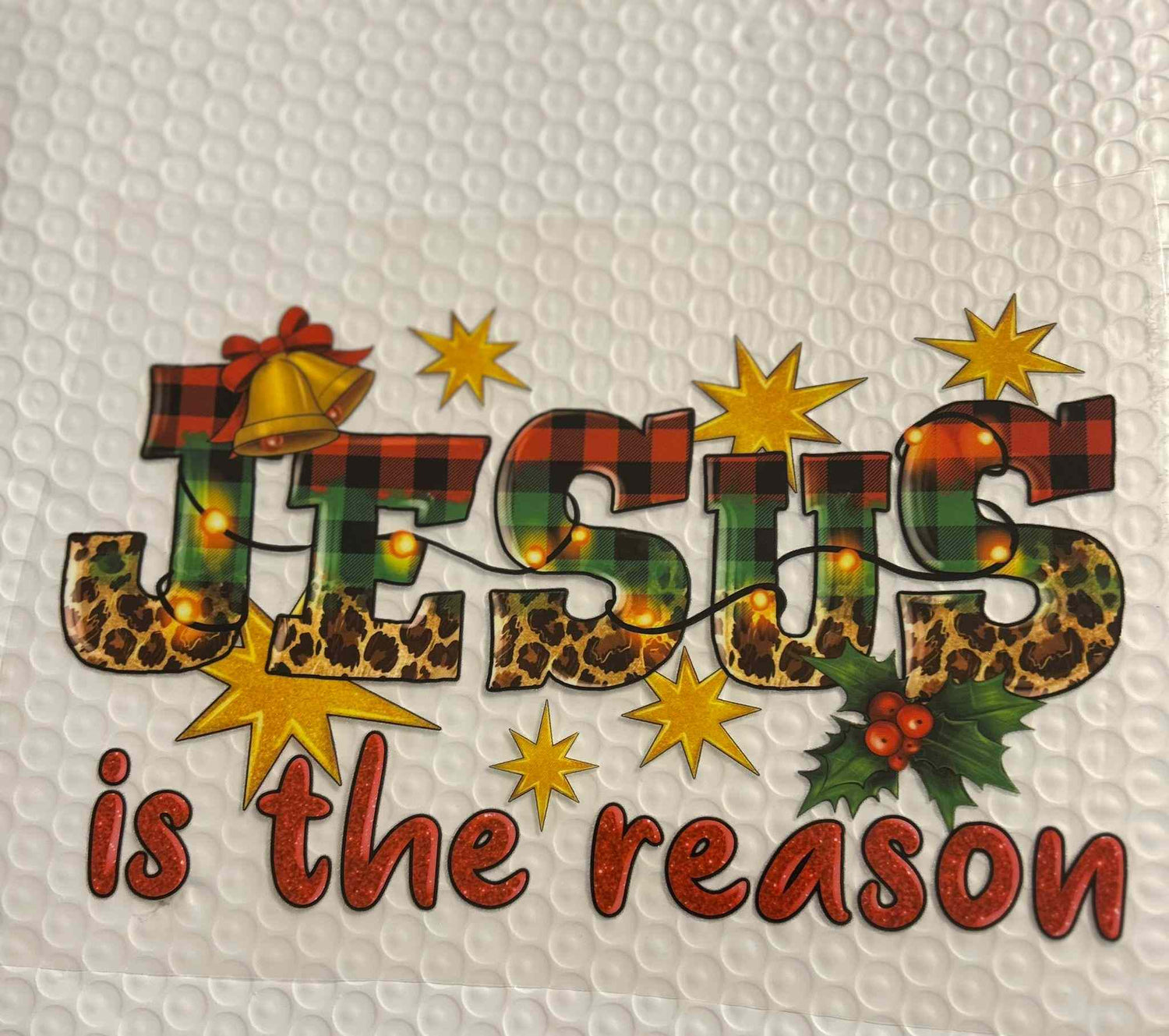 Holiday &amp; season design featuring &quot;Jesus is the reason&quot; text with festive decorations.