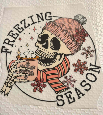 Holiday &amp; season design with skull in winter attire holding a hot drink.