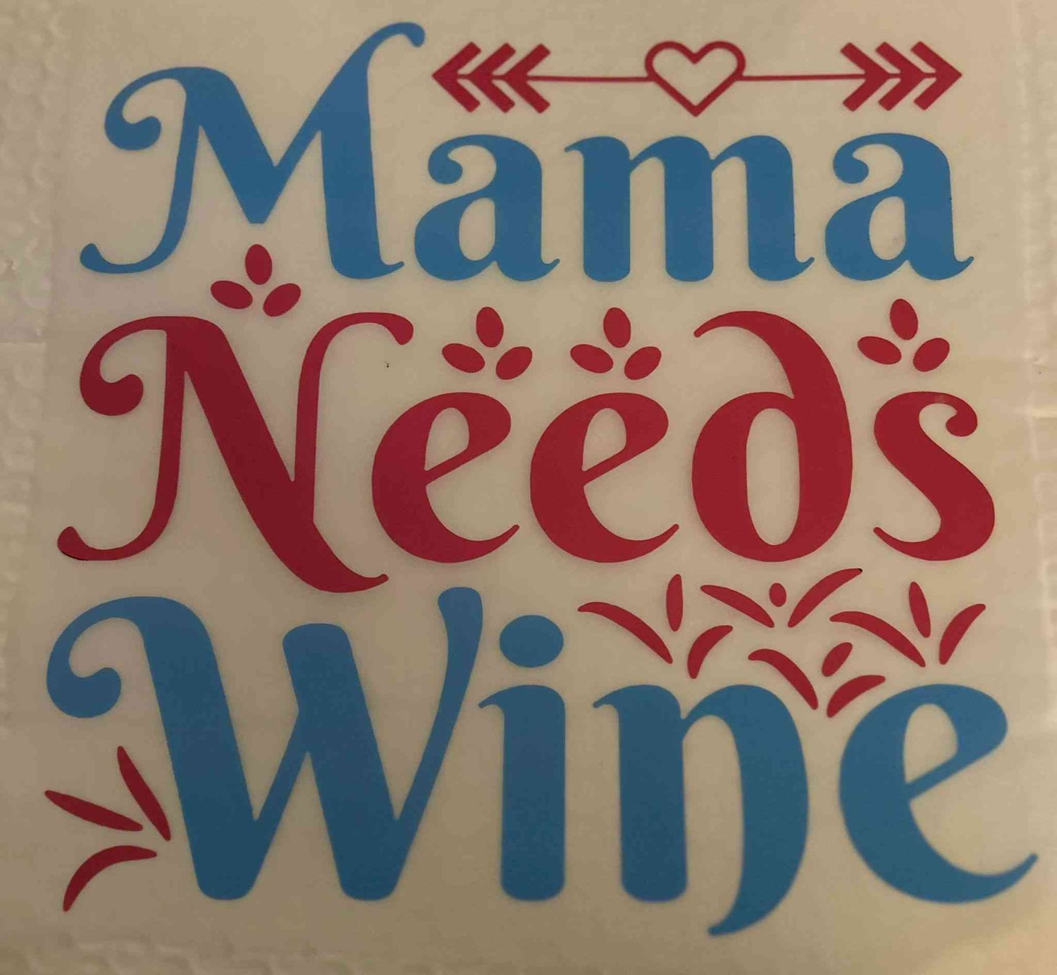 Colorful &quot;Mama Needs Wine&quot; saying design with heart and arrow embellishments. cute quote designs