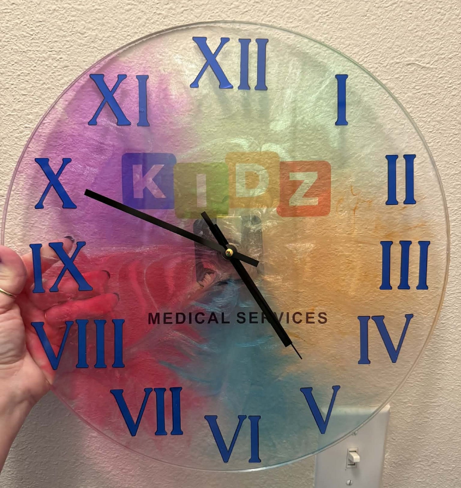 Colorful clock with Roman numerals and &