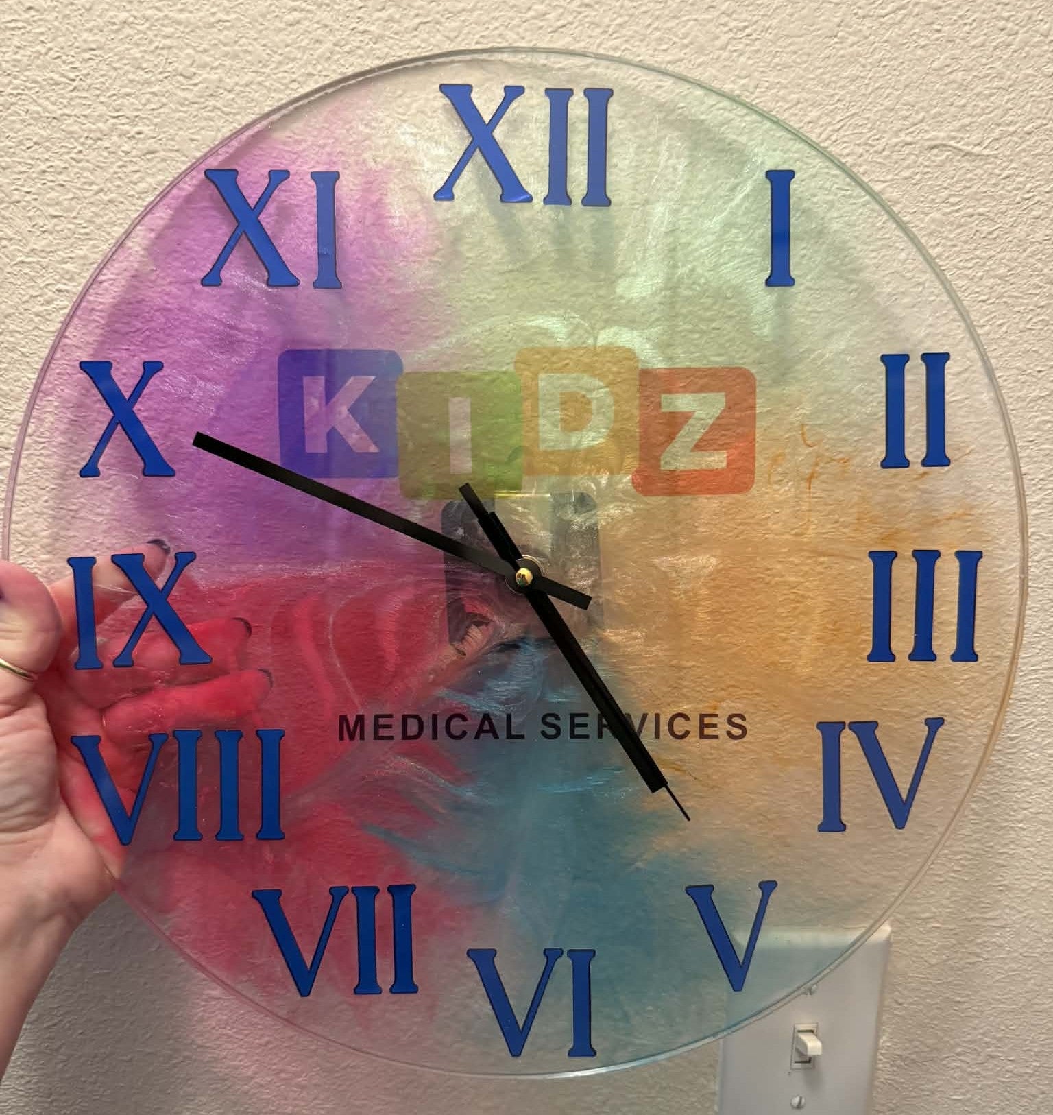 Colorful clock with Roman numerals and &