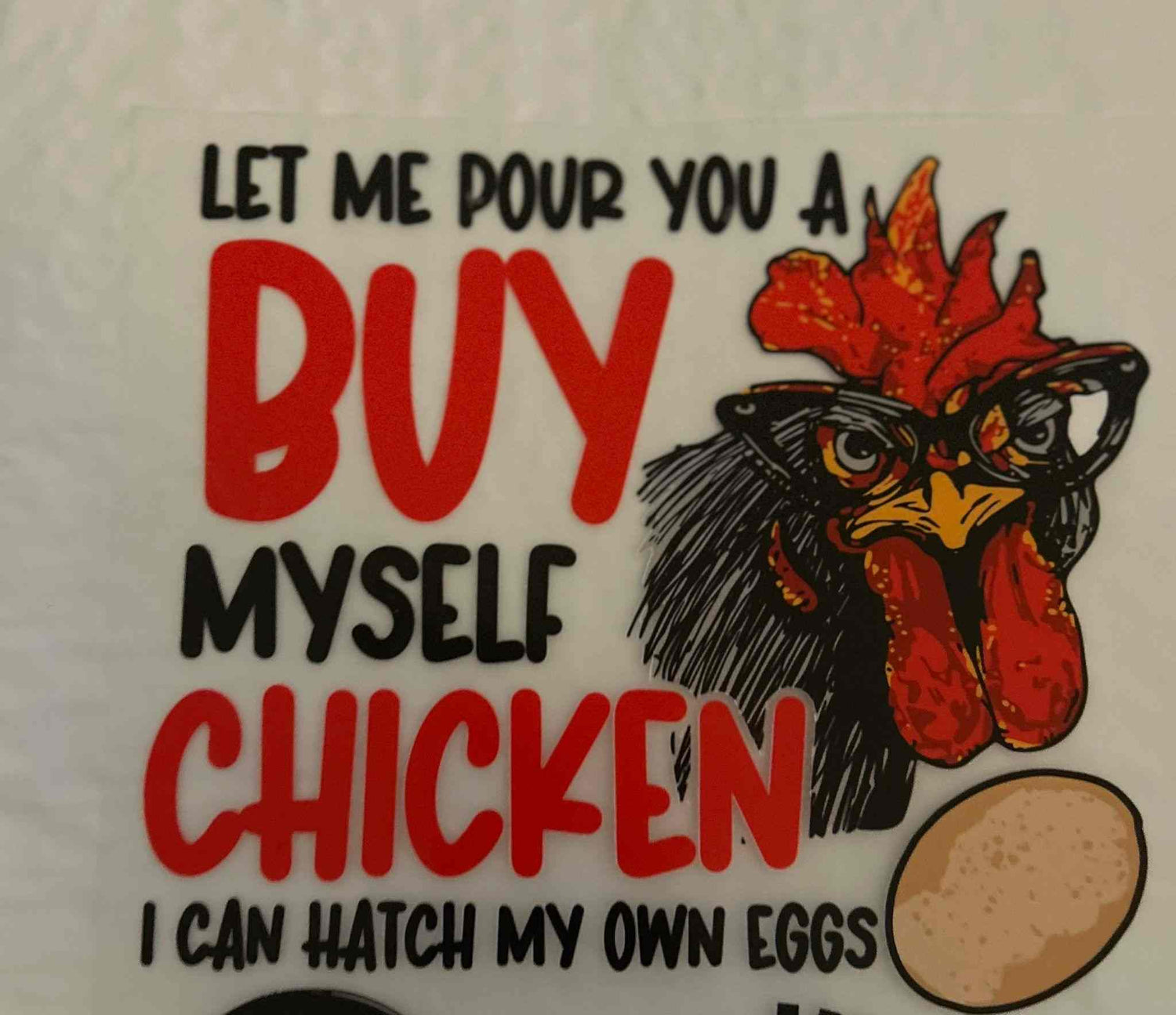 Animal-themed design featuring a rooster with humorous text about buying a chicken.