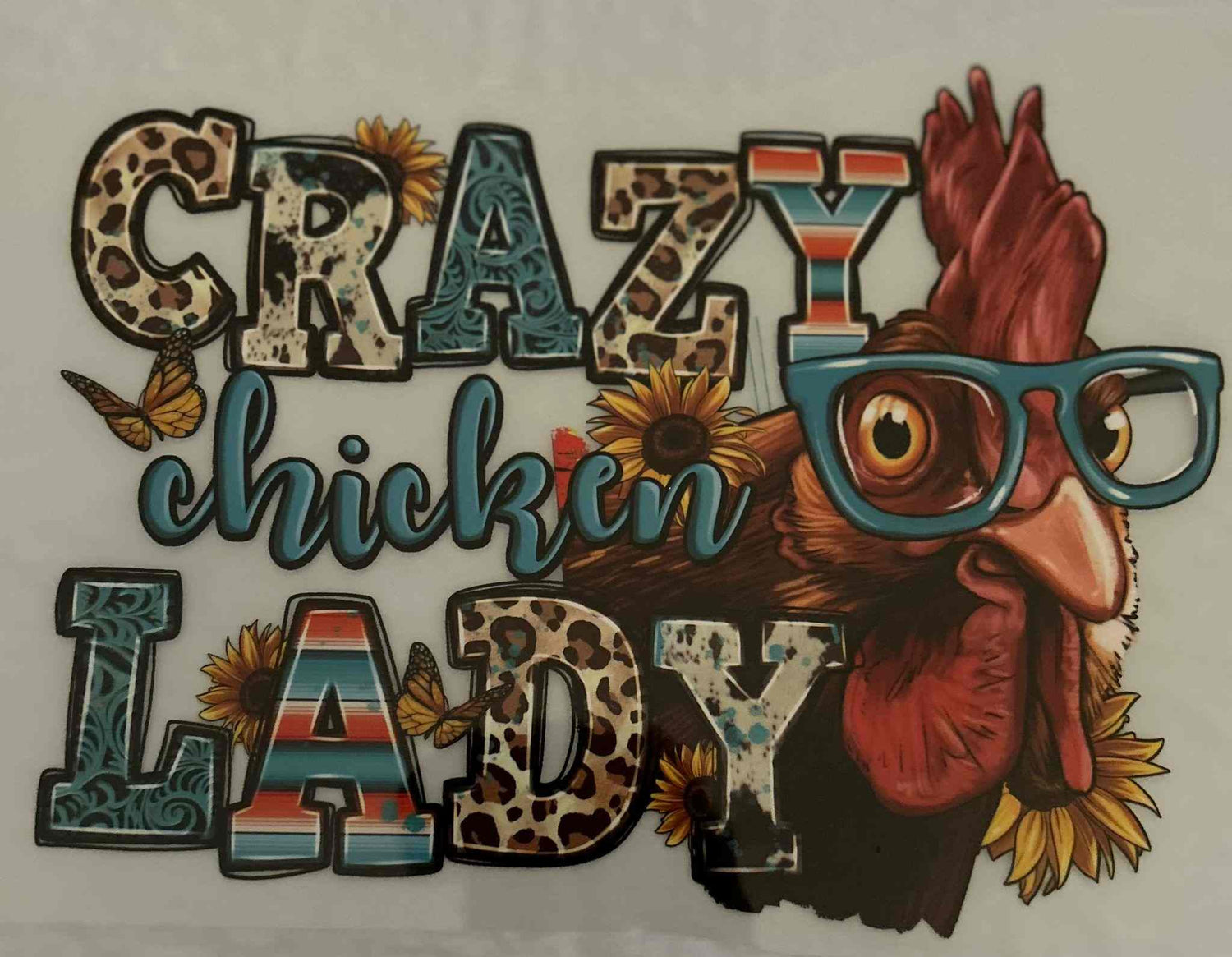 Colorful &quot;Crazy Chicken Lady&quot; design featuring a stylized chicken with glasses and sunflowers in an animal pattern style.