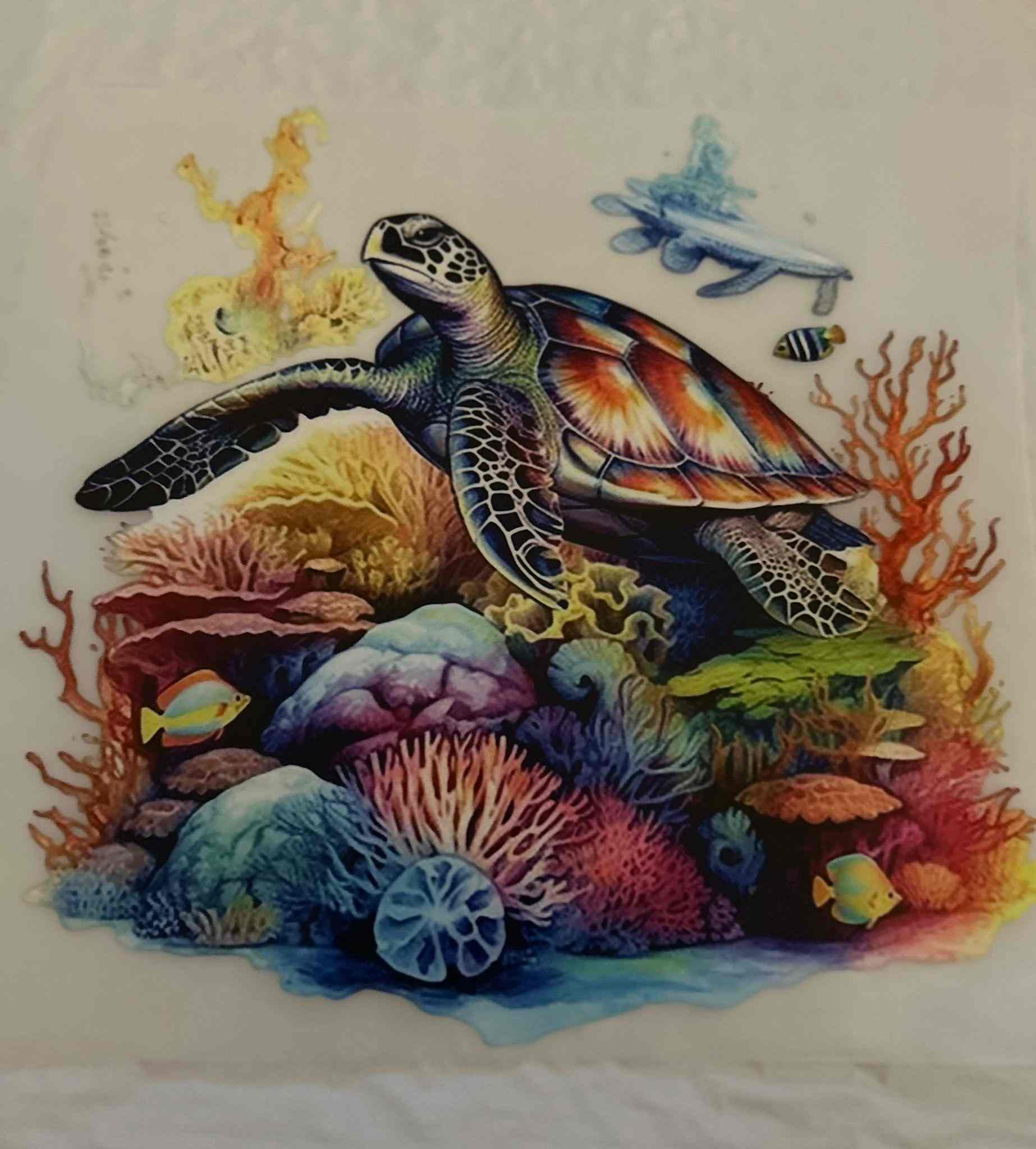 Colorful turtle design with coral and fish underwater scene.