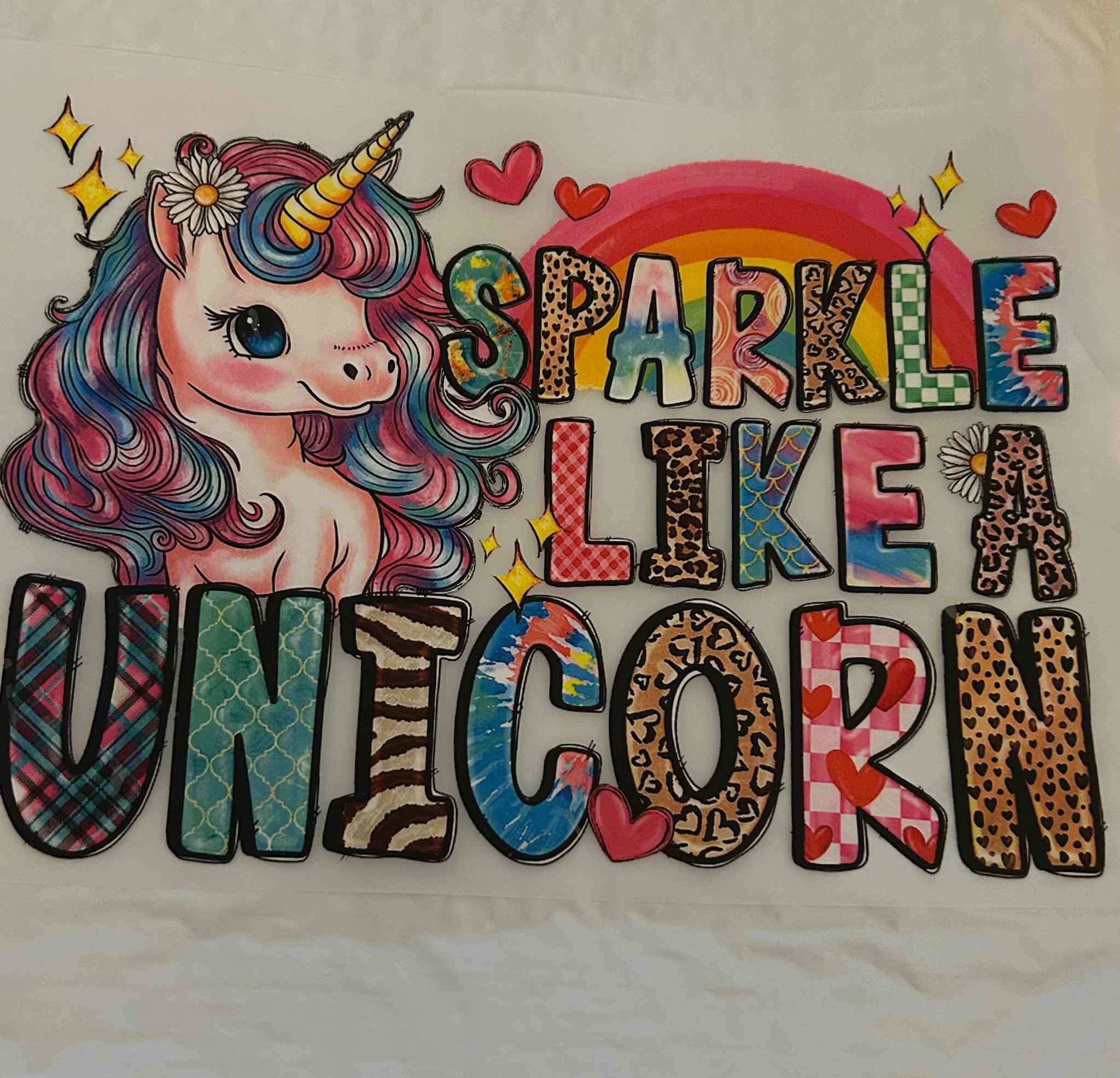 Colorful &quot;Sparkle Like a Unicorn&quot; animal design with vibrant patterns and a whimsical unicorn illustration.