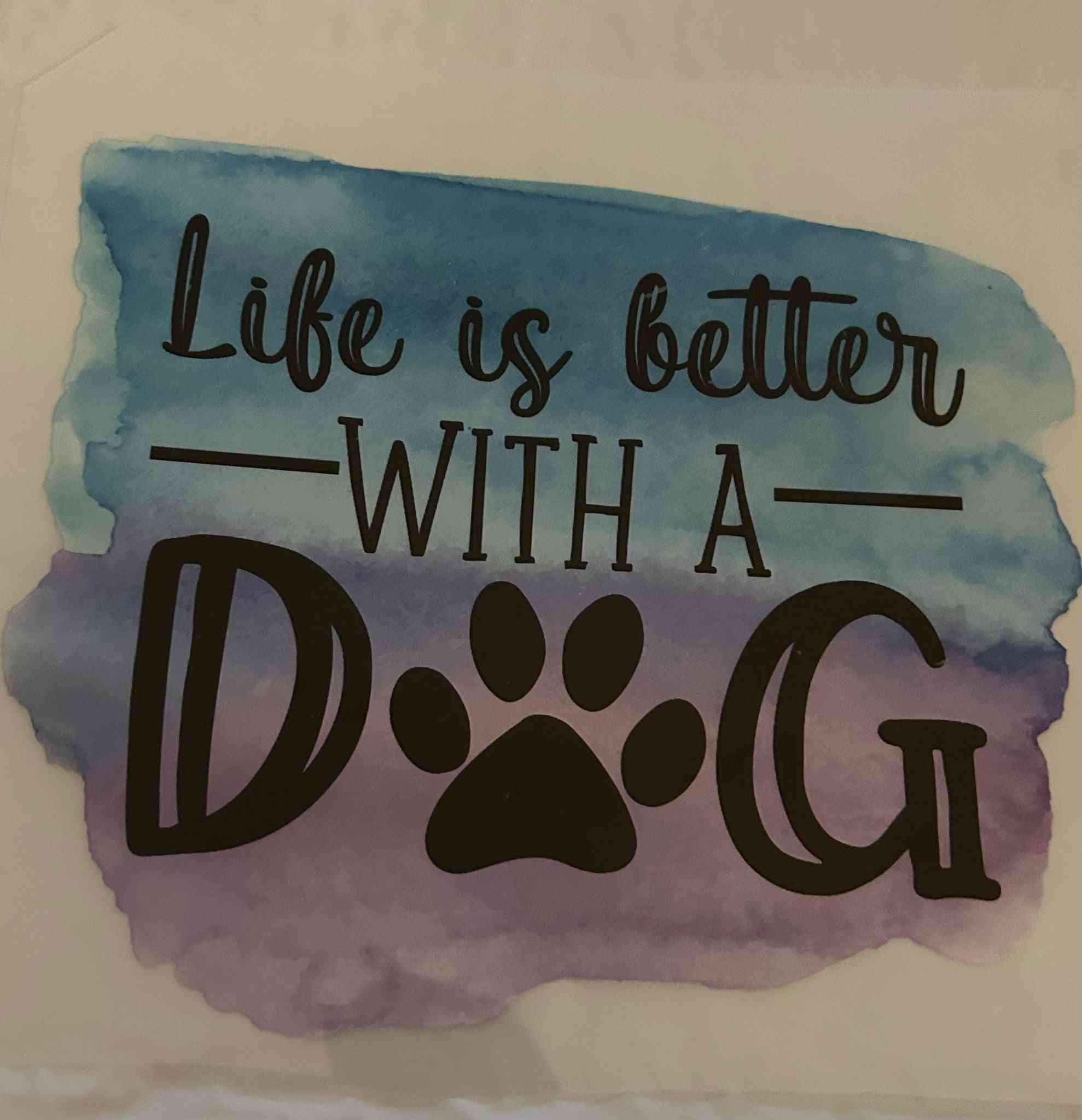 &quot;Life is better with a dog&quot; design with paw print on watercolor background, promoting animal design theme.