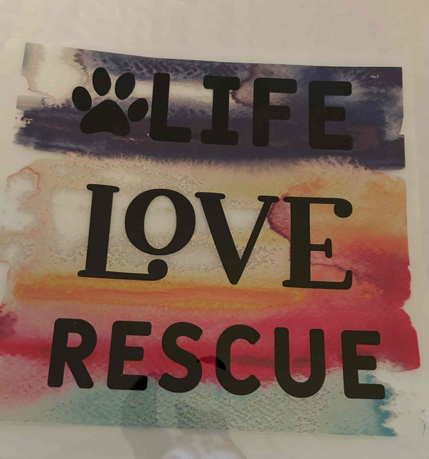 Animal Designs with colorful background and text &quot;Life Love Rescue.&quot;