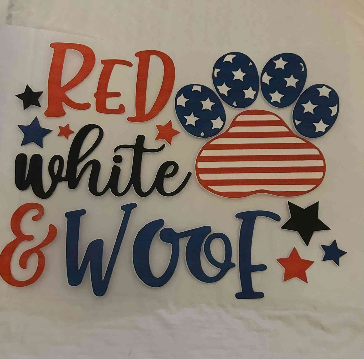 Red, white, and blue patriotic animal design with paw print and stars.