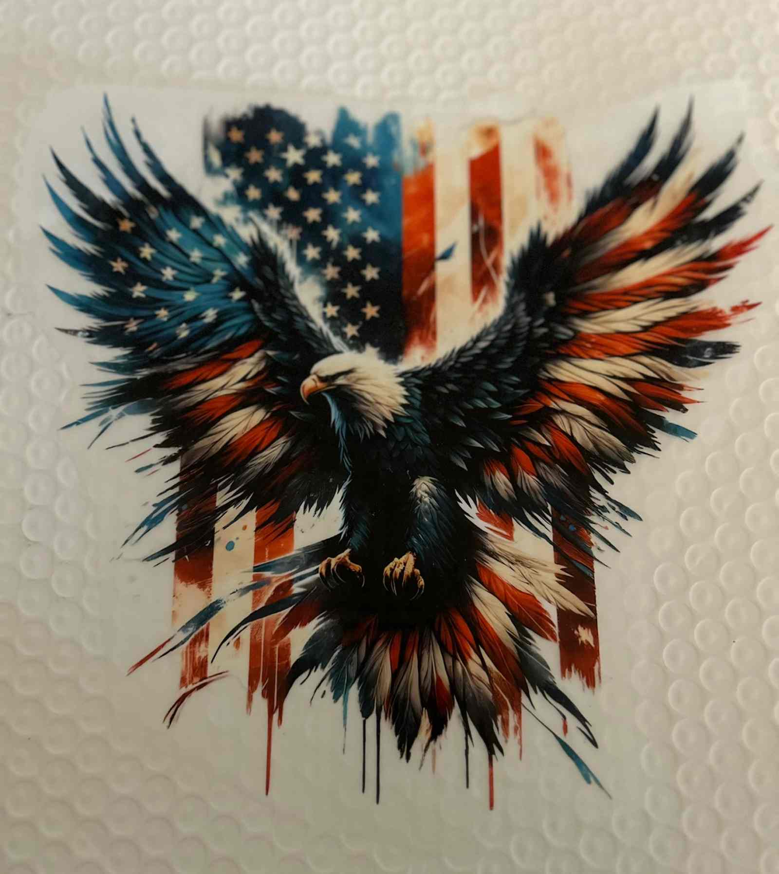 Patriotic design featuring an eagle with American flag background.