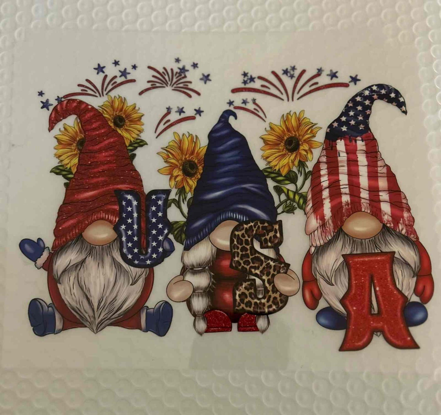 Patriotic gnome designs with American flag hats and sunflowers.