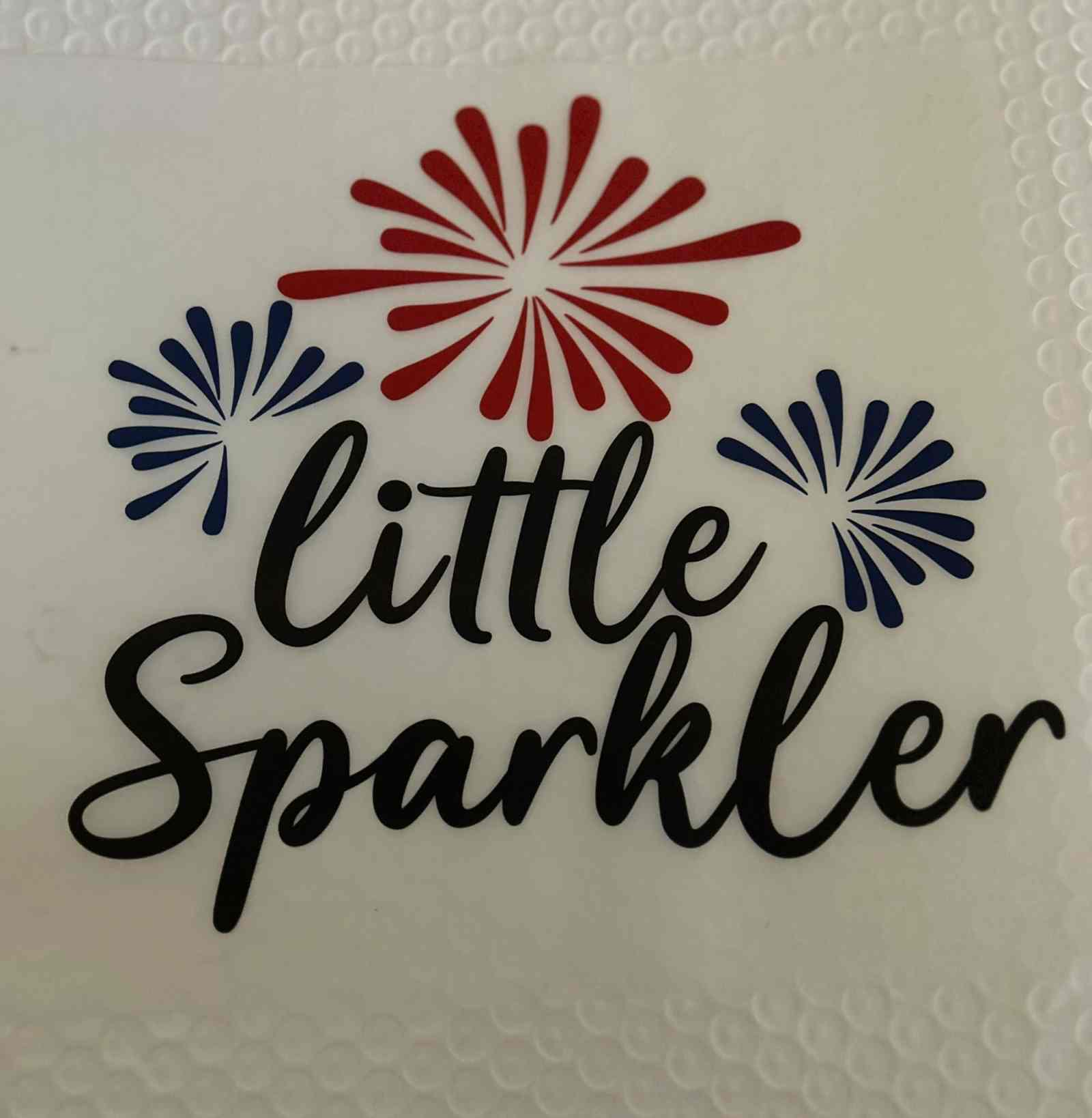 Patriotic design with red and blue fireworks, text &quot;Little Sparkler&quot;.