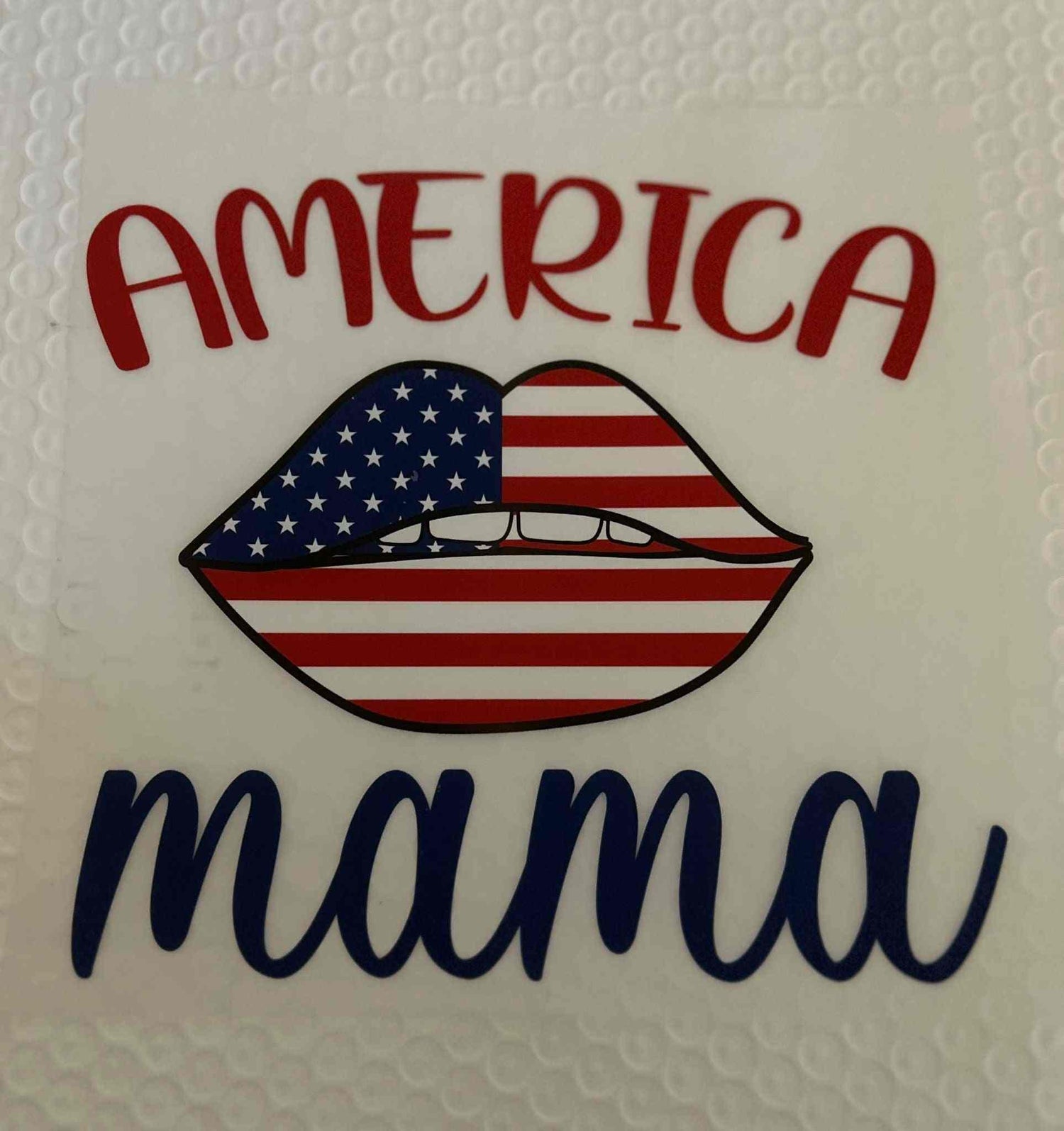 American flag lips with &quot;America Mama&quot; text, patriotic design.