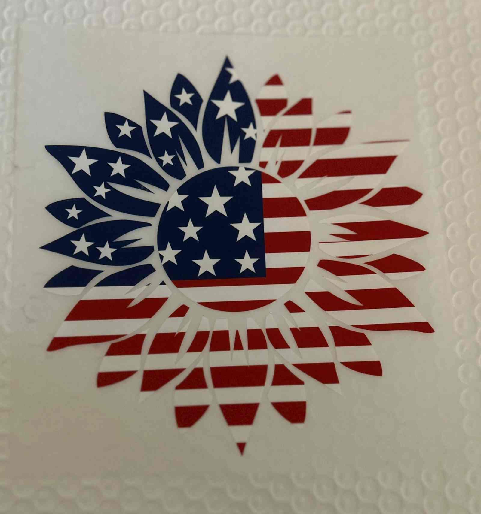 Patriotic sunflower design with American flag elements.