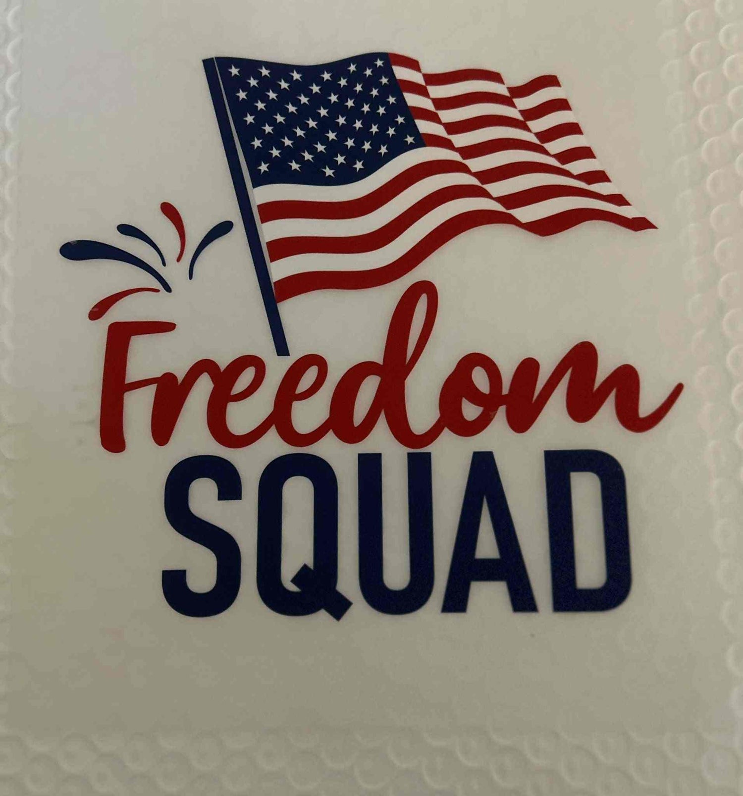 American flag design with &quot;Freedom Squad&quot; text, featuring a patriotic theme.