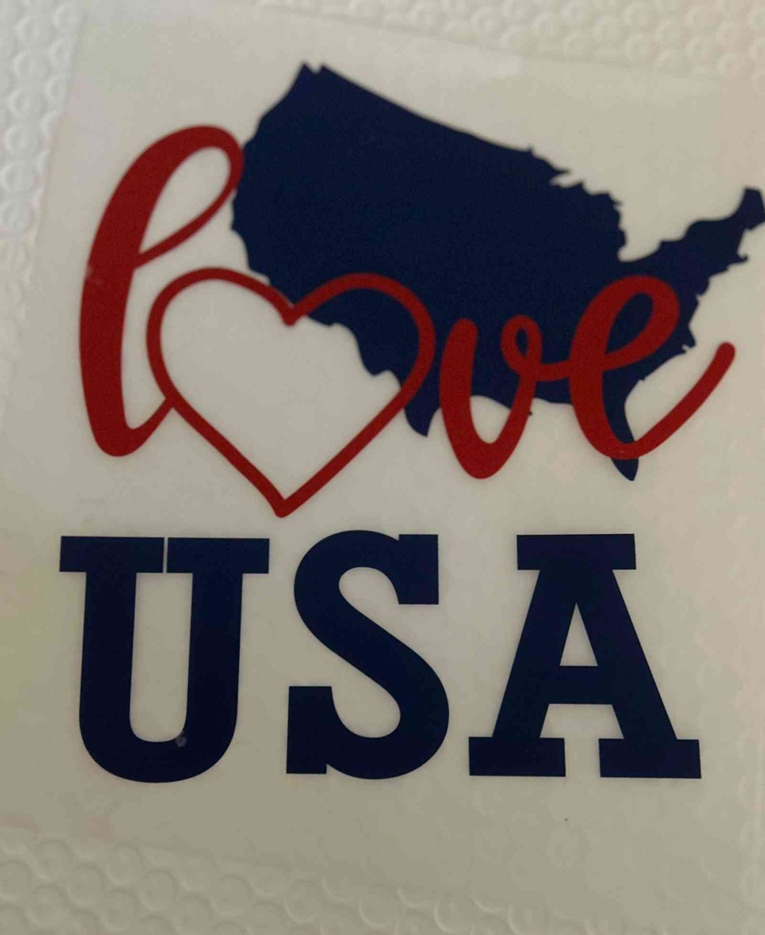 Patriotic Design featuring a heart-shaped map of the USA with &quot;Love USA&quot; text.