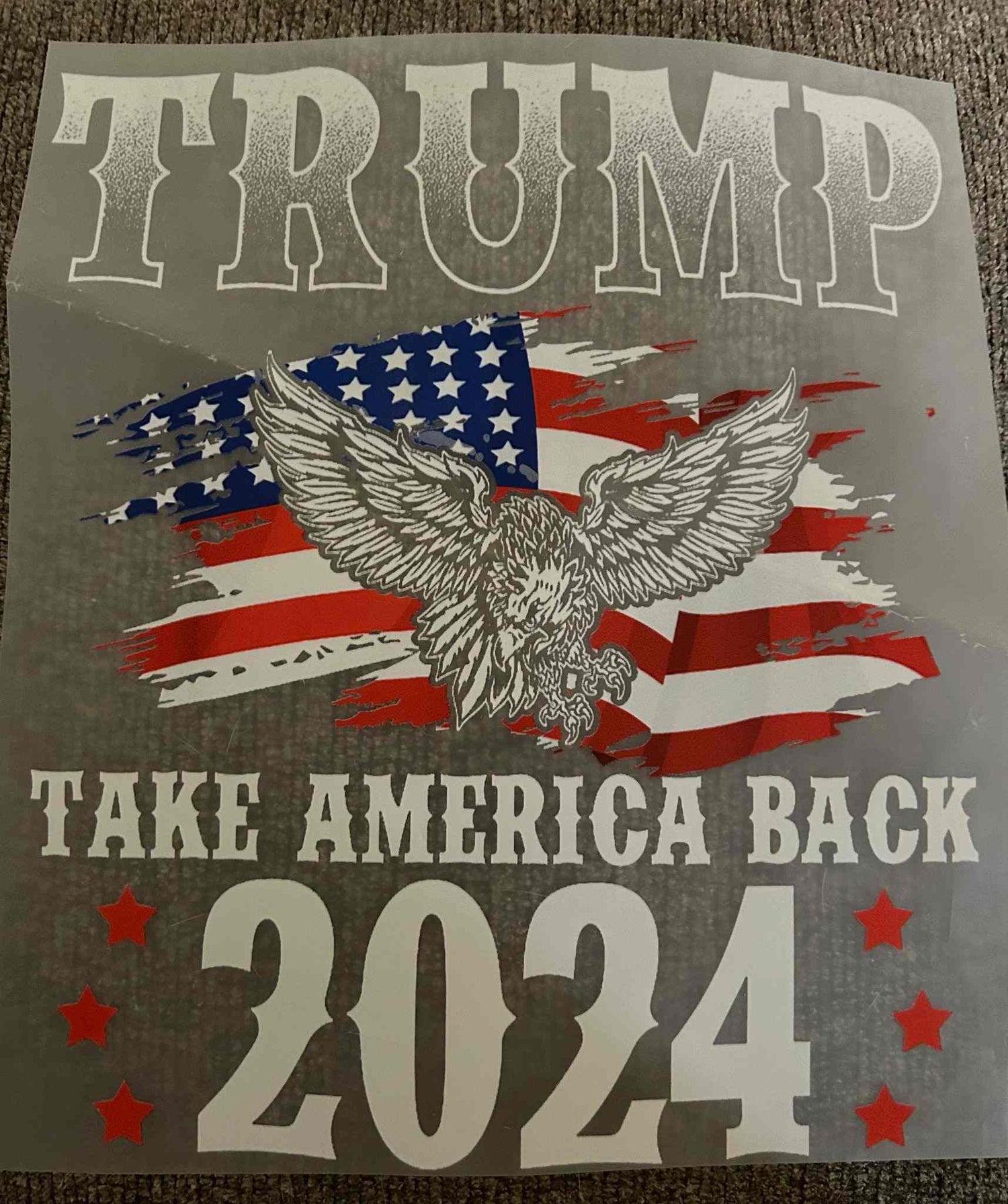 Patriotic design with an eagle and American flag, featuring the text &quot;Trump Take America Back 2024.&quot;