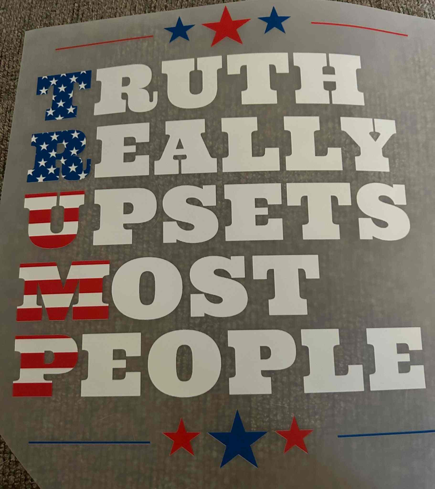 Patriotic design with American flag theme and bold statement: &quot;Truth Really Upsets Most People&quot;.