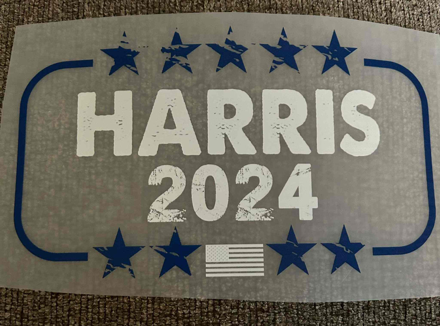 Patriotic design featuring &quot;Harris 2024&quot; with stars and American flag.