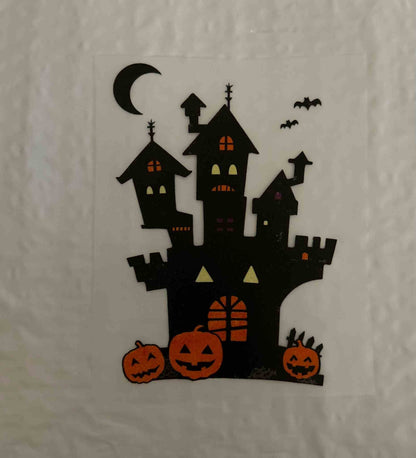 Spooky Halloween castle design with pumpkins and bats.