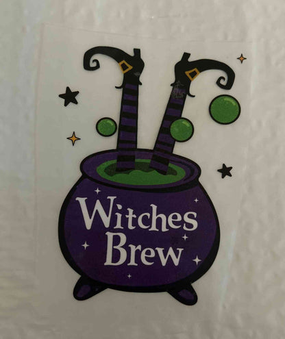 Holiday &amp; season design featuring a cauldron with &quot;Witches Brew&quot; text and festive decorations.