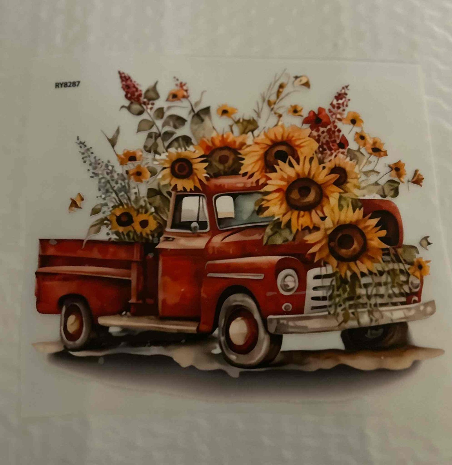 Red vintage truck with sunflowers, holiday and season design.