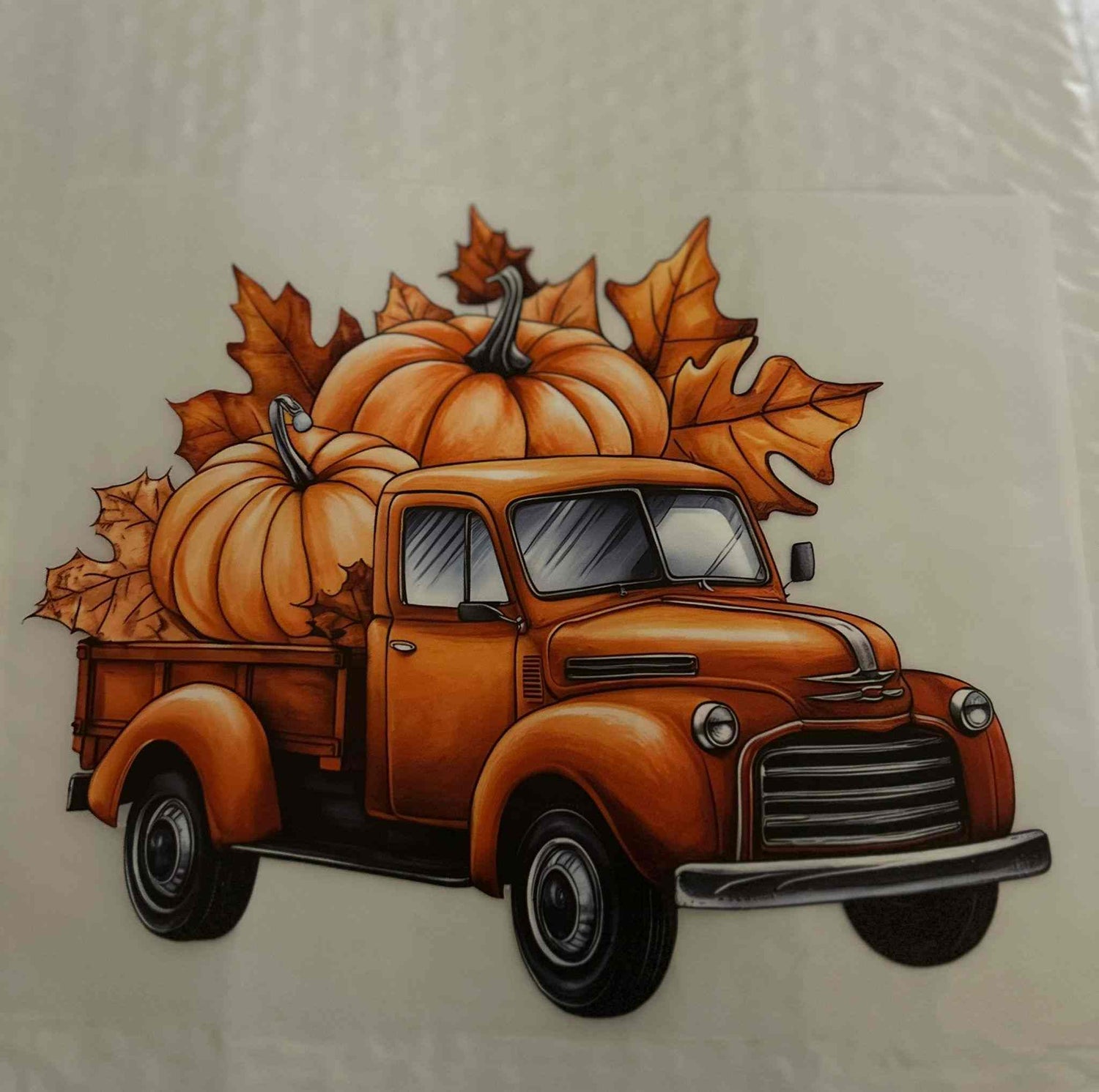 Orange vintage truck with pumpkins and autumn leaves, ideal for adding a festive holiday &amp; season design.