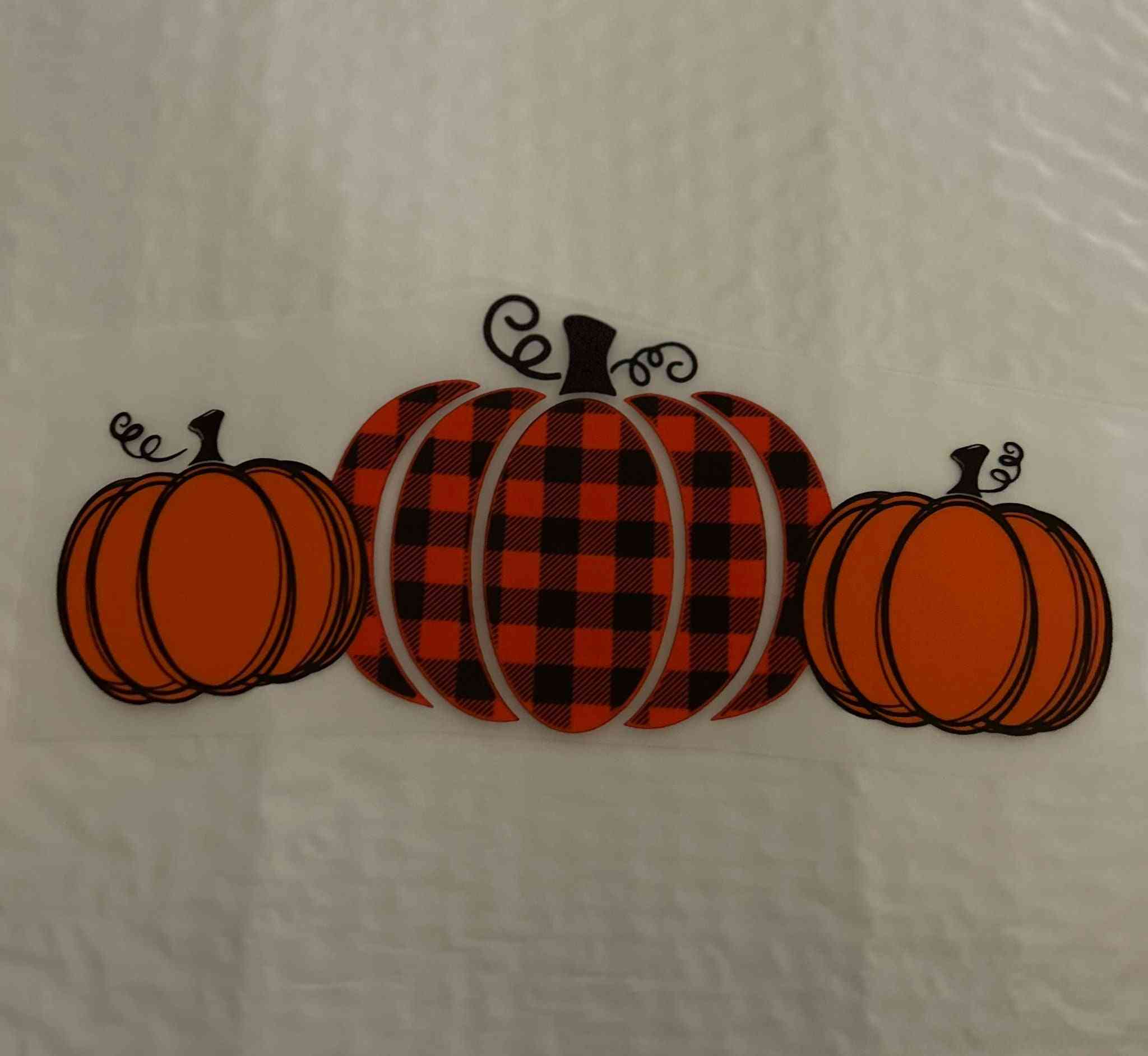 Holiday &amp; season design with plaid and solid orange pumpkins.