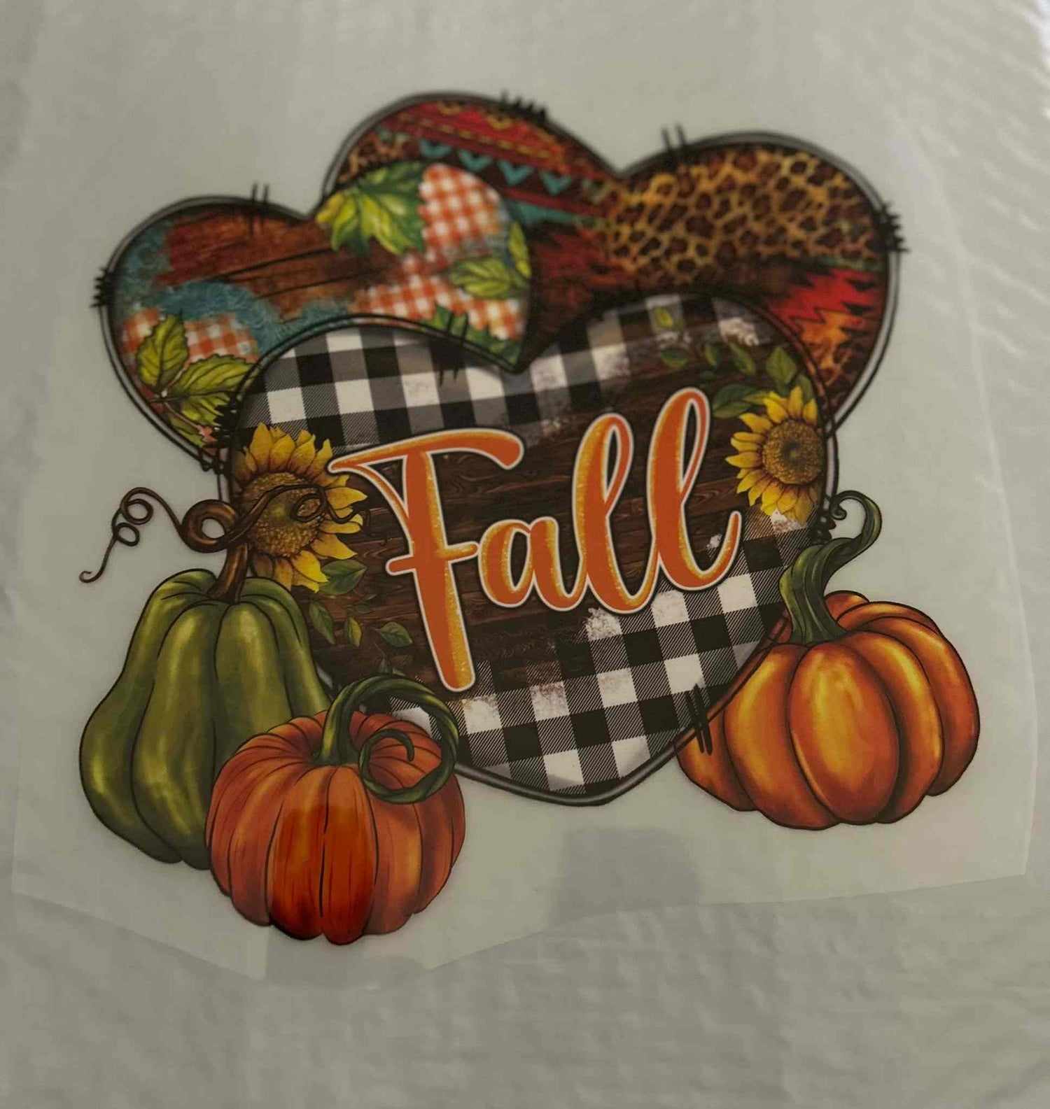 Fall-themed holiday and season design with pumpkins and heart patterns.