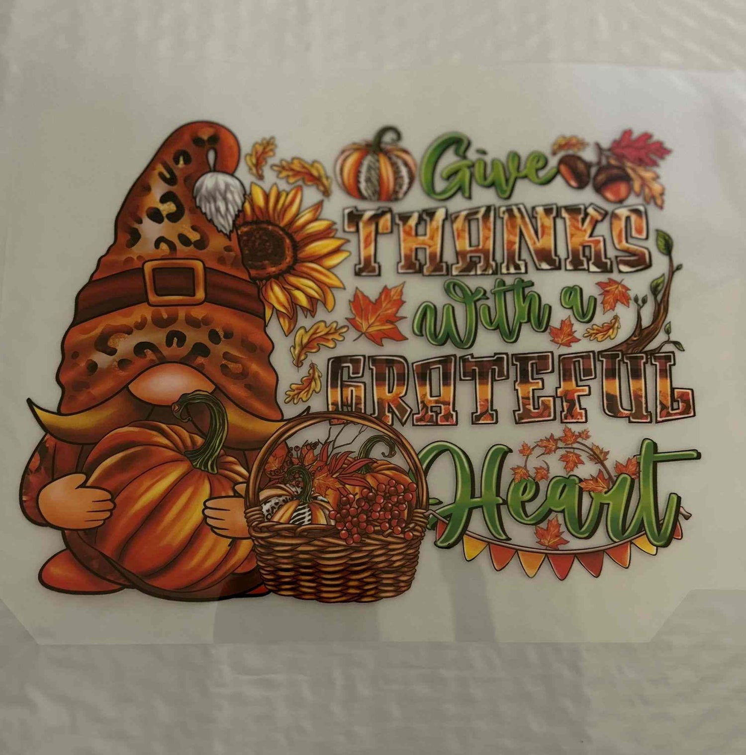 Holiday &amp; Season design with autumn theme, featuring a gnome, pumpkins, and a &quot;Give Thanks with a Grateful Heart&quot; message.